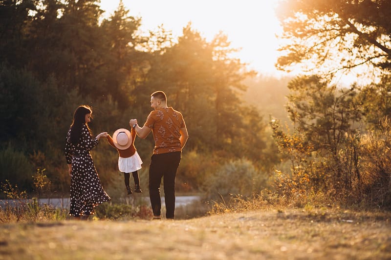 family with their little daughter autumn field scaled